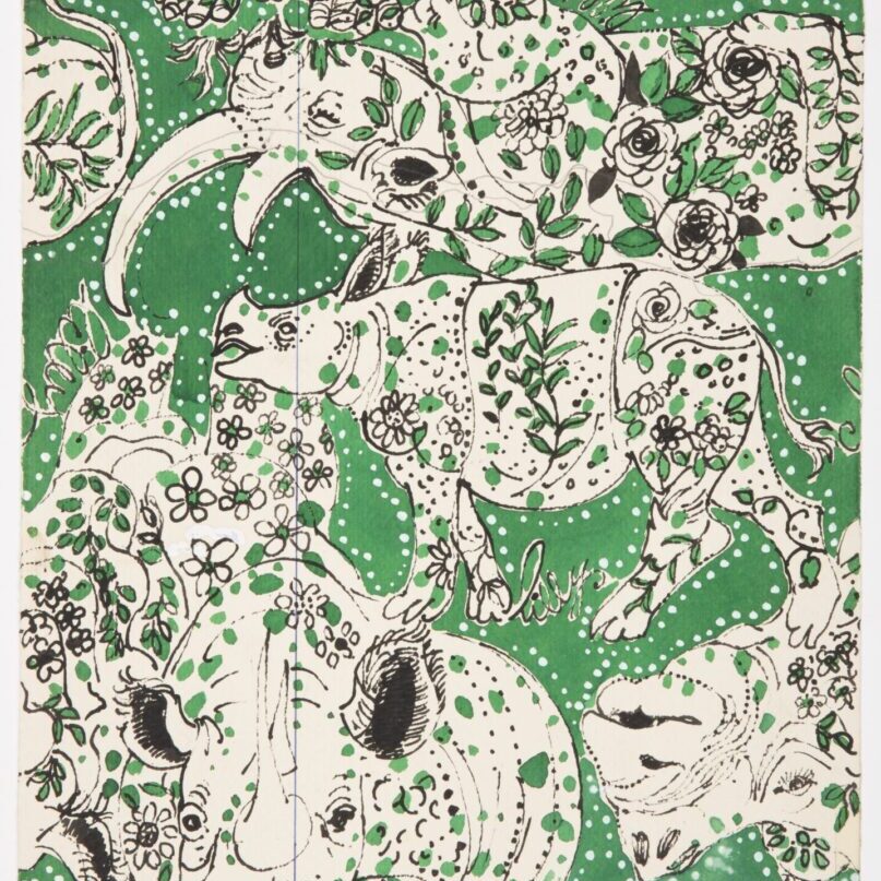 A green and white elephant pattern with flowers.